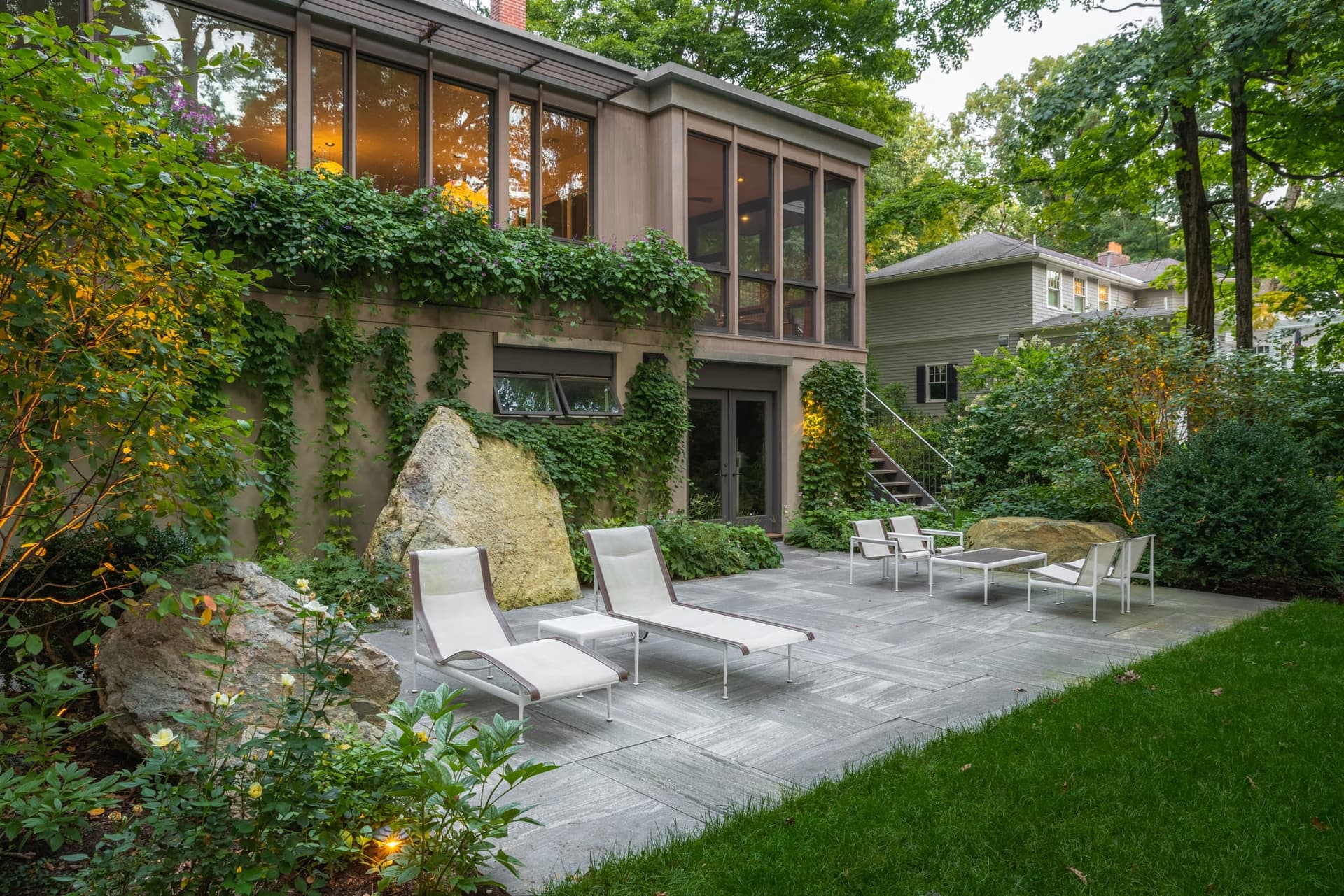 Full-color bluestone patio with a fire feature in Wellesley, MA