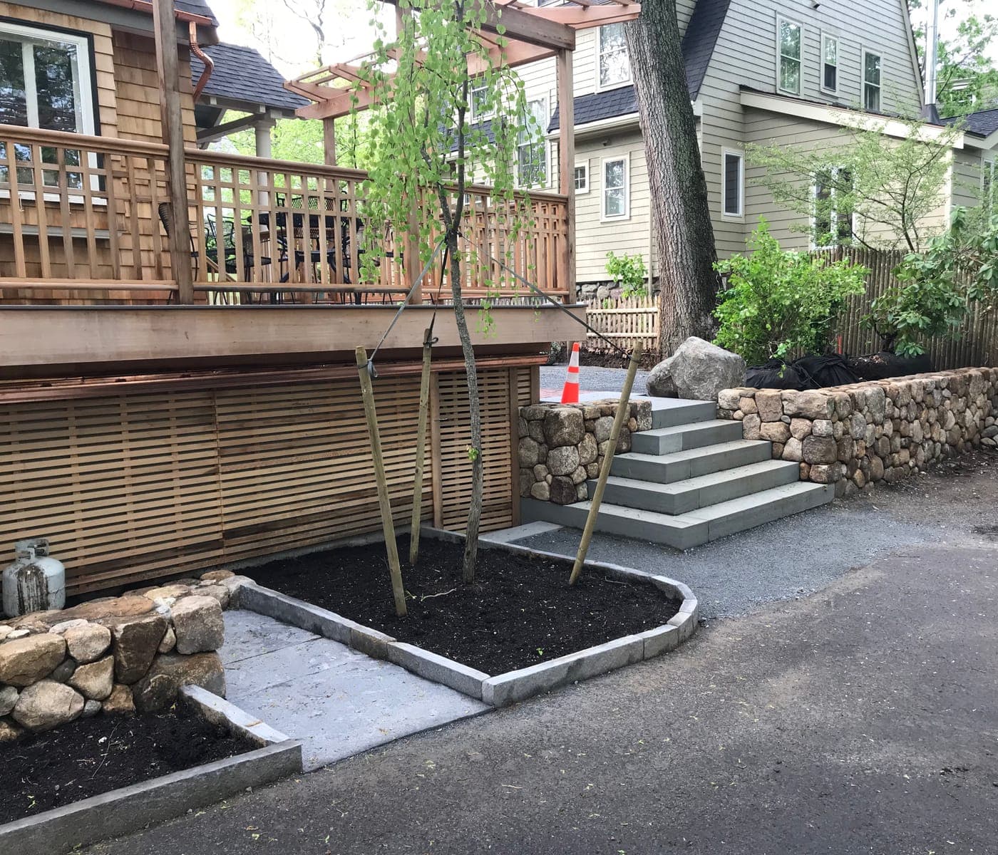 Dry-stacked fieldstone retaining wall in Newton, MA